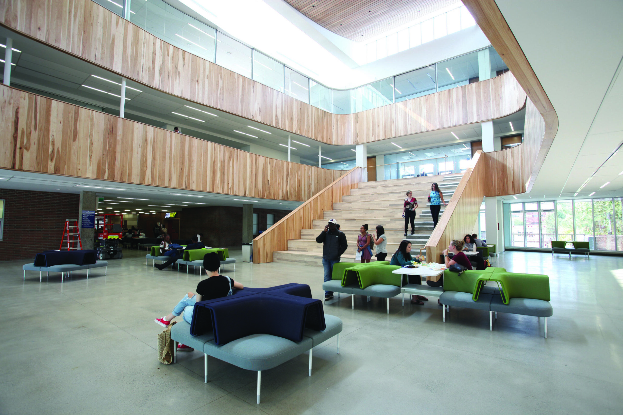 A photo of a common area in a large bright educational space