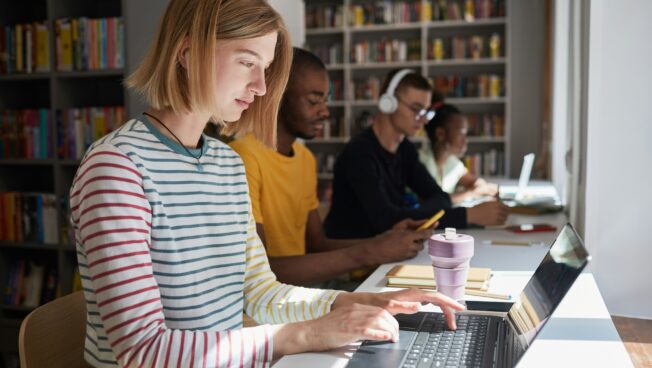 A student studying in a library setting