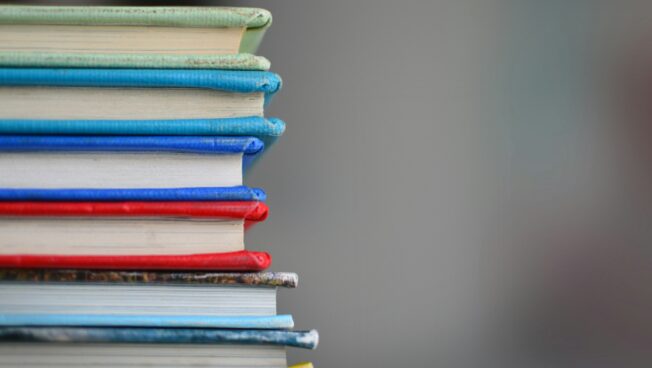 A close-up of a stack of books