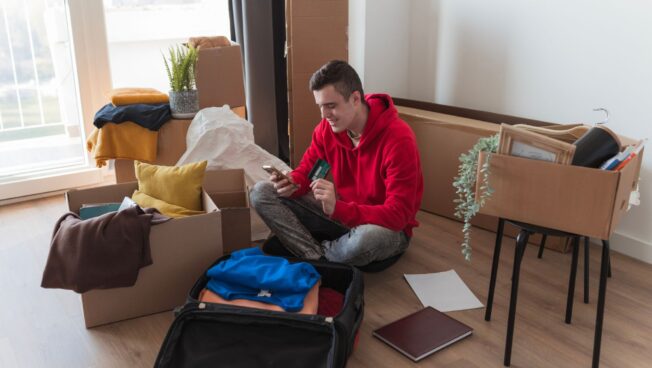 A student setting up his dorm after moving to university