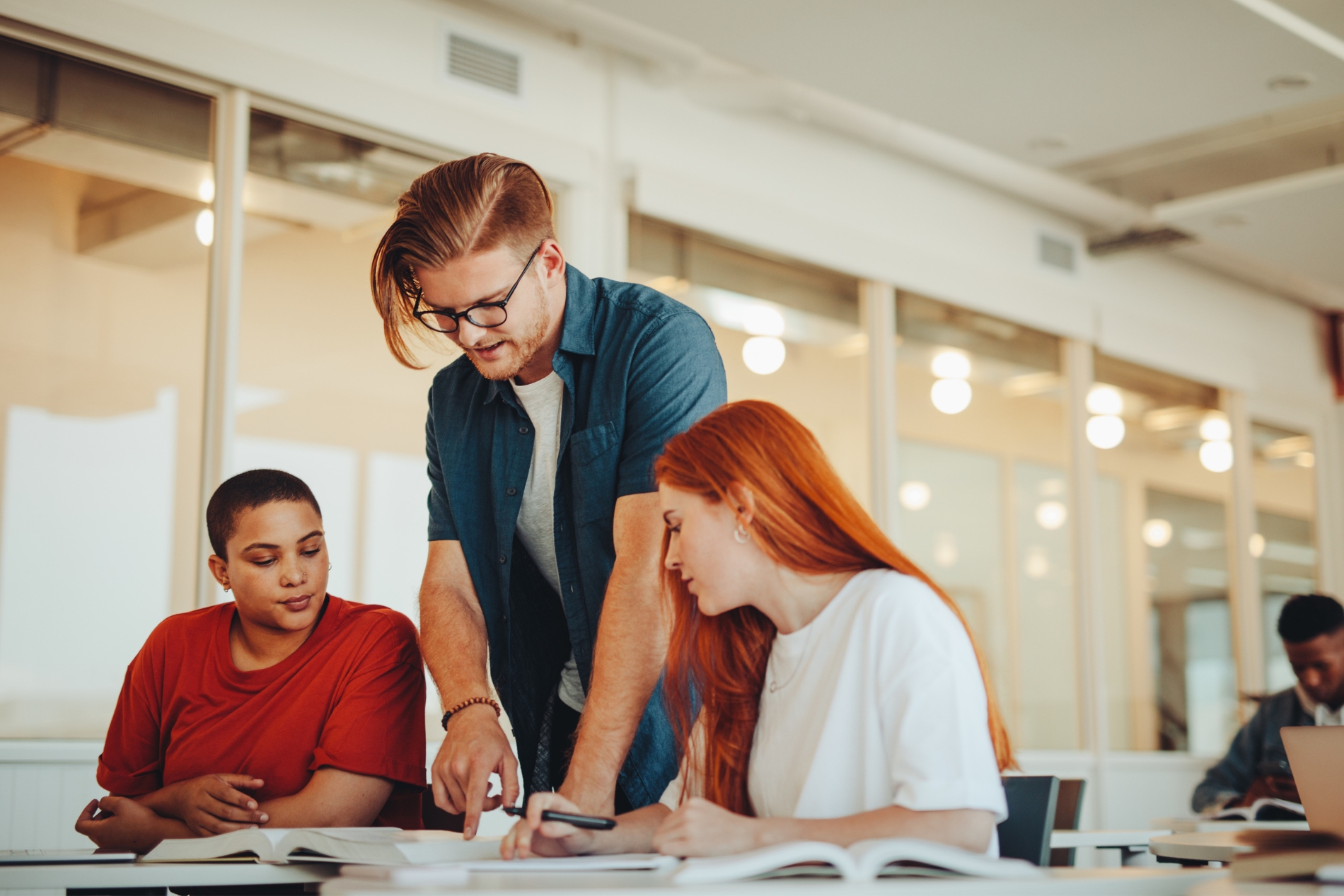 Professor helping students with selecting their electives