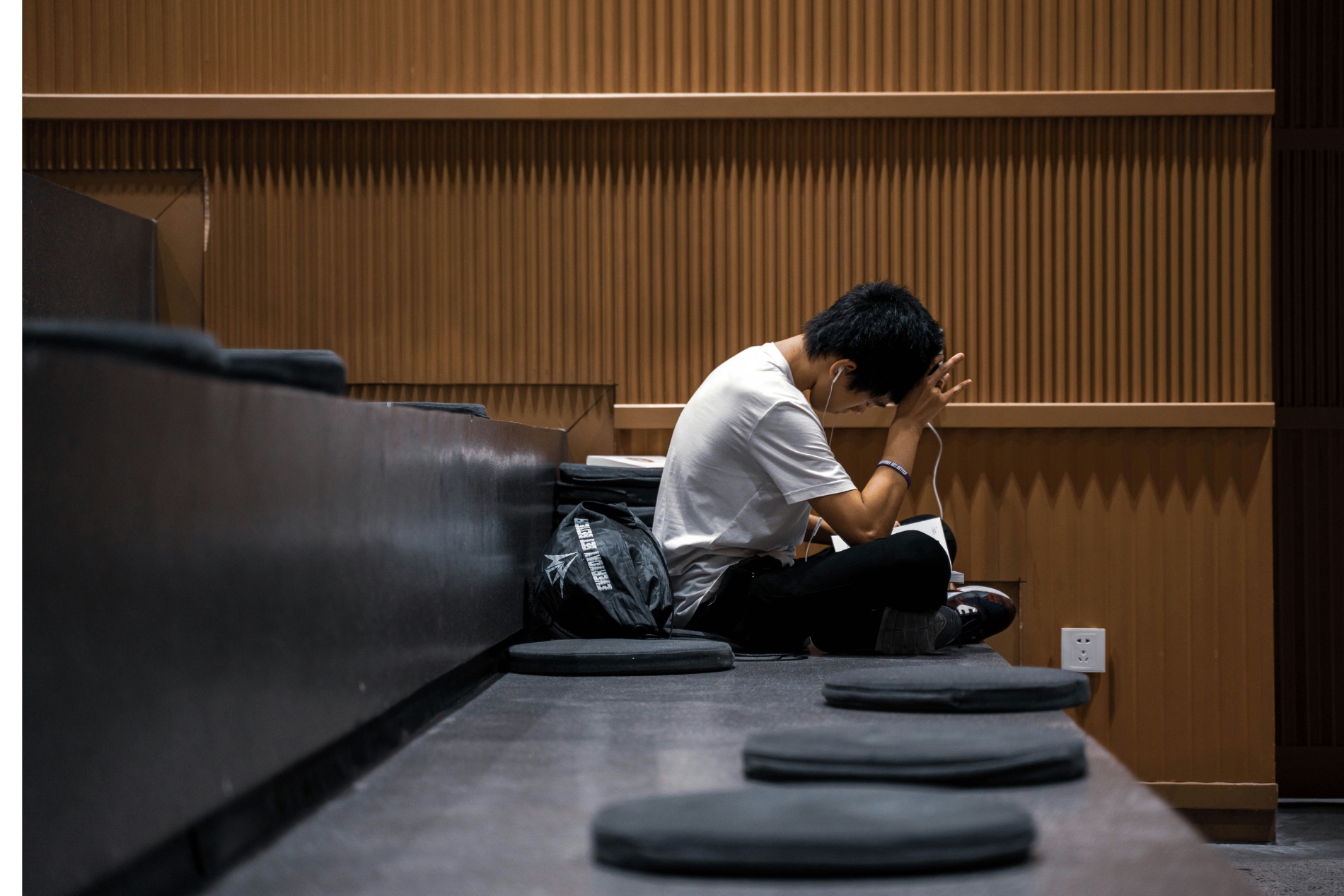 University student sitting lonely on campus