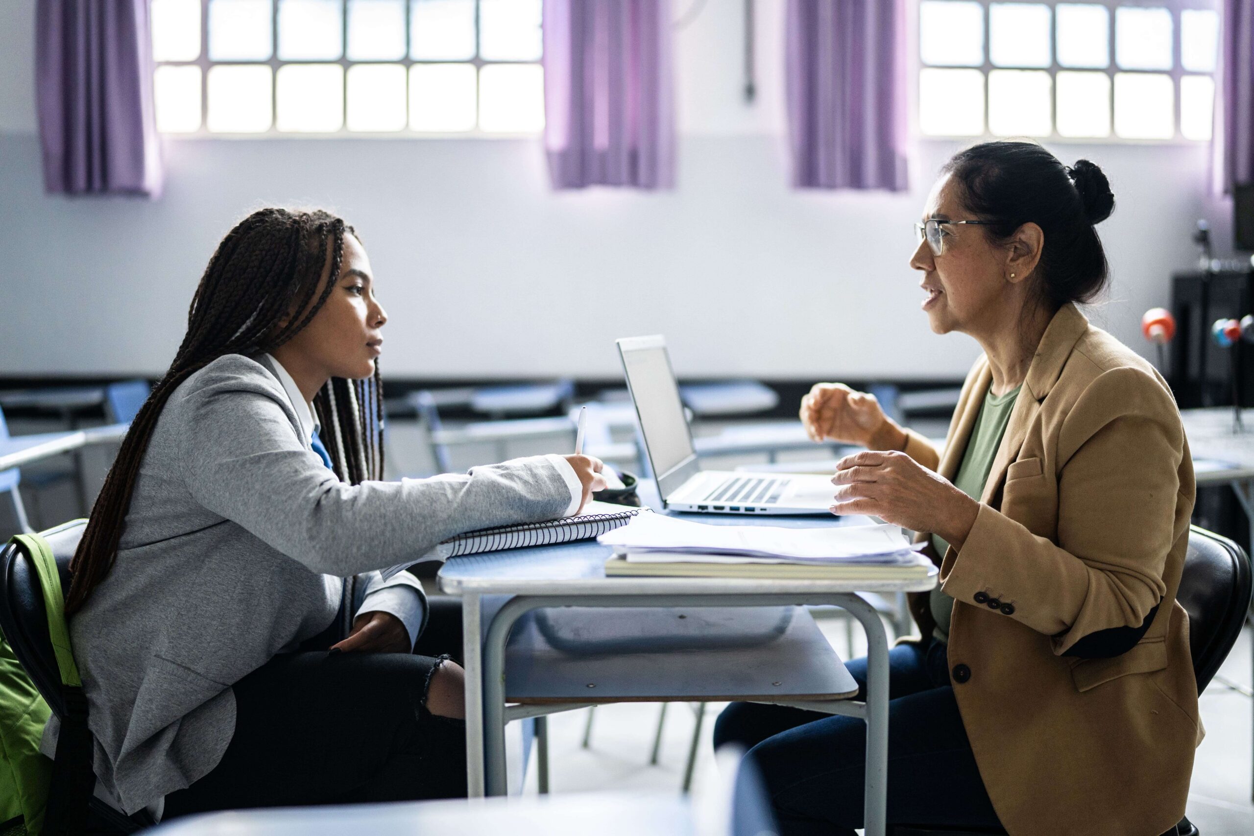 Student discussing grades with professor